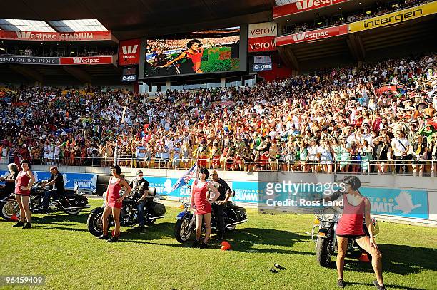 Dancers are delivered onto the ground by Harley Davidsons' to entertain the crowd during day two of the Wellington IRB Sevens at Westpac Stadium on...