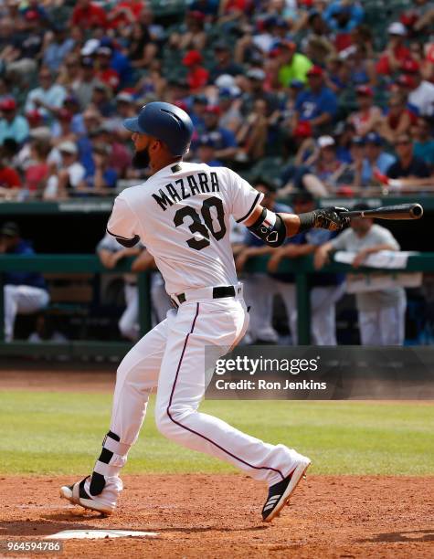 Nomar Mazara of the Texas Rangers flies out against the Kansas City Royals at Globe Life Park in Arlington on May 27, 2018 in Arlington, Texas. The...