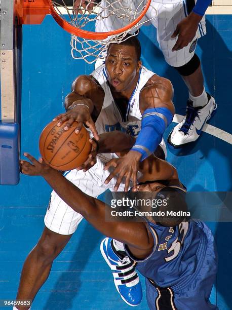 Dwight Howard of the Orlando Magic blocks a shot against Brendan Haywood of the Washington Wizards during the game on February 5, 2010 at Amway Arena...
