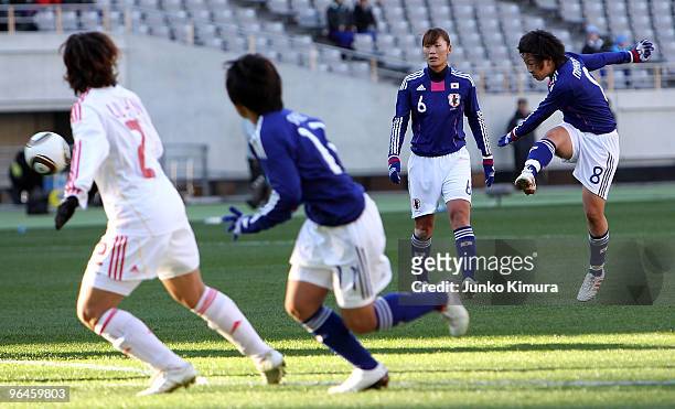Aya Miyama of Japan scores the first goal during the East Asian Football Federation Women's Football Championship 2010 match between Japan and China...