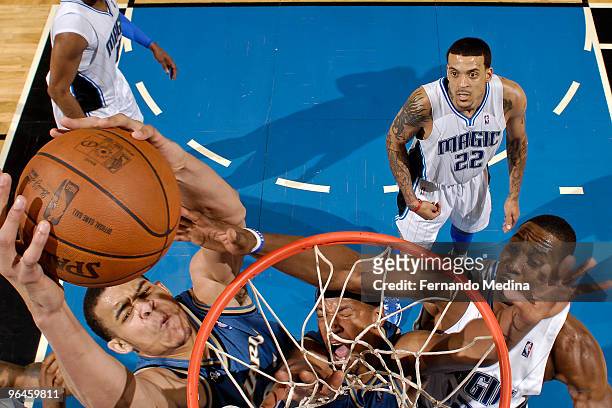 February 5: JaVale McGee of the Washington Wizards dunks back an offensive rebound against Dwight Howard of the Orlando Magic as his teammate Dominic...