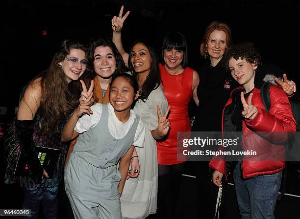 Actress Rosario Dawson, writer Eve Ensler, actress Cynthia Nixon and her daughter Samantha Mozes pose with cast members at the V-Day benefit reading...