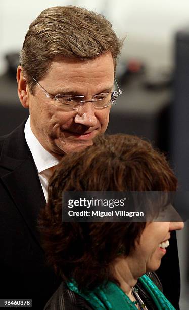 German Foreign Minister Guido Westerwelle looks towards EU foreign policy chief Catherine Ashton during the second day of the 46th Munich Security...