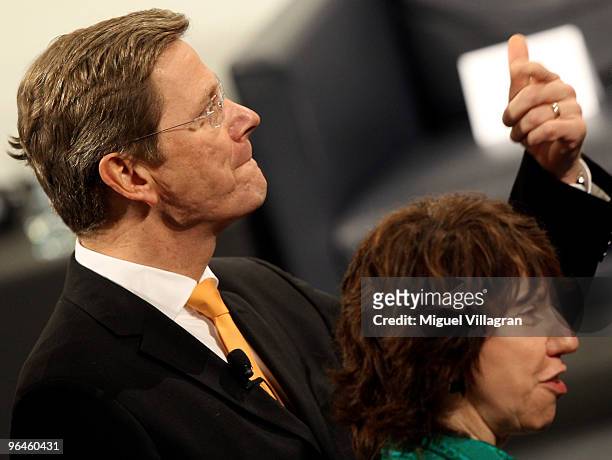 German Foreign Minister Guido Westerwelle gestures next to EU foreign policy chief Catherine Ashton during the second day of the 46th Munich Security...