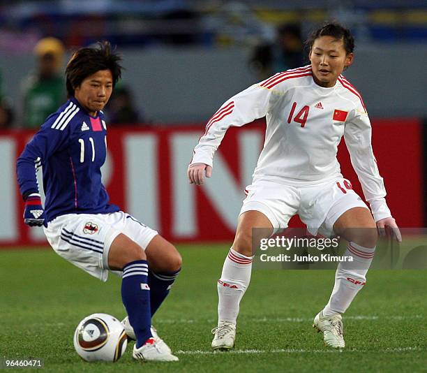 Shinobu Ohno of Japan and Danyang Li of China compete for the ball during the East Asian Football Federation Women's Football Championship 2010 match...