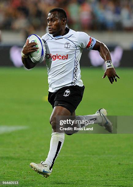 Emosi Vucago of Fiji runs in to score a try in the final match between Fiji and Samoa during day two of the Wellington IRB Sevens at Westpac Stadium...