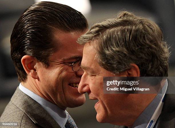 German Defence Minister Karl-Theodor zu Guttenberg walks past U.S. Special Representative for Afghanistan and Pakistan Richard Holbrooke during the...