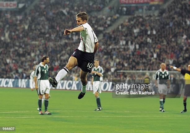 Michael Owen of England celebrates after scoring a goal during the FIFA 2002 World Cup Qualifier against Germany played at the Olympic Stadium in...