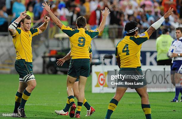 Patrick McCeheon, Clinton Sills and Brian Sefanai of Australia celebrat their win in the plate final match between South Africa and Australia during...