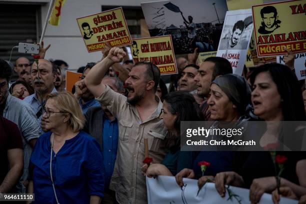 Protestors hold posters and shout slogans during a protest marking the fifth anniversary of the Gezi Park protests on Istiklal street on May 31, 2018...