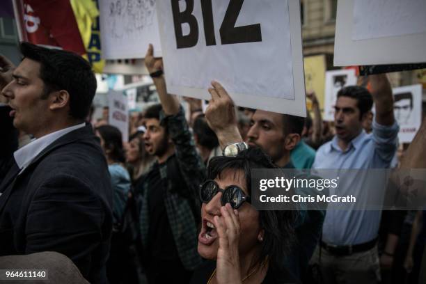 Protestors hold posters and shout slogans during a protest marking the fifth anniversary of the Gezi Park protests on Istiklal street on May 31, 2018...