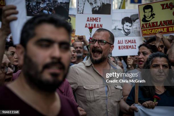 Protestors hold posters and shout slogans during a protest marking the fifth anniversary of the Gezi Park protests on Istiklal street on May 31, 2018...