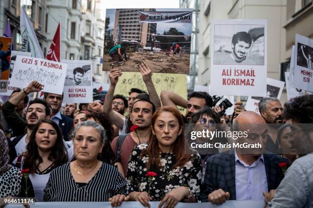 Protestors hold posters and shout slogans during a protest marking the fifth anniversary of the Gezi Park protests on Istiklal street on May 31, 2018...