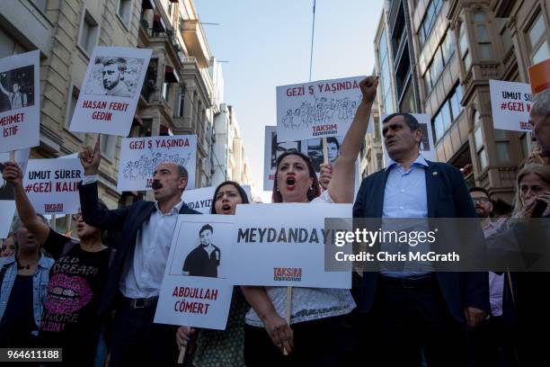 Protestors hold posters and shout slogans during a protest marking the fifth anniversary of the Gezi Park protests on Istiklal street on May 31, 2018...