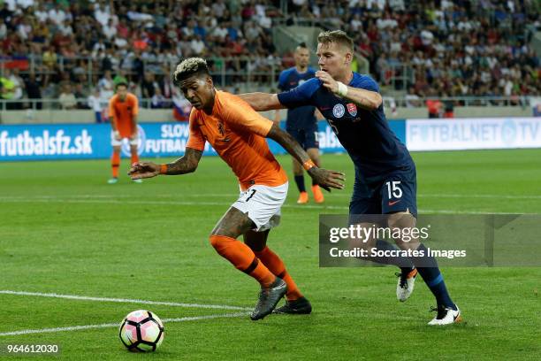 Patrick van Aanholt of Holland, Tomas Hubocan of Slovakia during the International Friendly match between Slovakia v Holland at the City Arena on May...