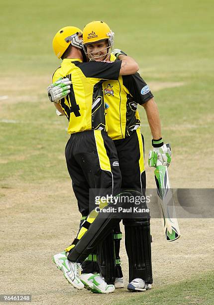 Luke Pomersbach of the Warriors is congratulated by Luke Ronchi after scoring his century during the Ford Ranger Cup match between the Western...