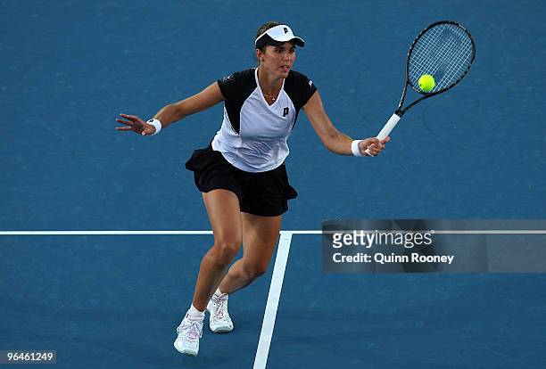 Maria Jose Martinez Sanchez of Spain plays a forehand volley in her singles match against Sam Stosur of Australia during the 2010 Fed Cup World Group...