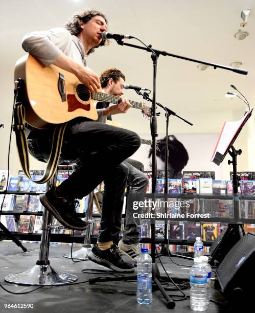 Gary Lightbody and Nathan Connolly of Snow Patrol during an in-store signing and performance of their new album 'Wildness' at HMV Manchester on May...