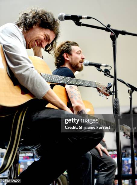 Gary Lightbody and Nathan Connolly of Snow Patrol during an in-store signing and performance of their new album 'Wildness' at HMV Manchester on May...