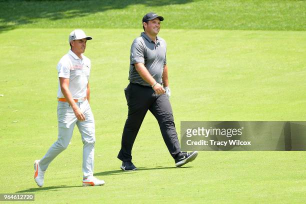 Patrick Reed and Rickie Fowler chat while walking up the 9th hole during the first round of the Memorial Tournament presented by Nationwide at...