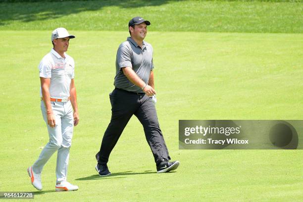 Patrick Reed and Rickie Fowler chat while walking up the 9th hole during the first round of the Memorial Tournament presented by Nationwide at...