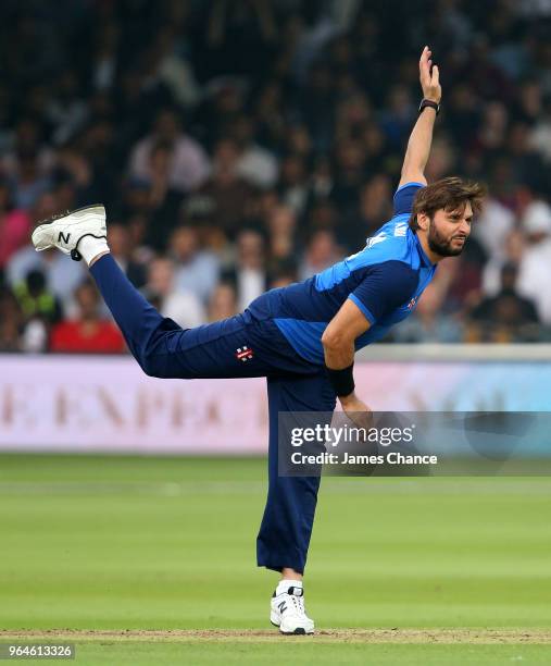 Shahid Afridi of the ICC World XI bowls during the Hurricane Relief T20 match between the ICC World XI and West Indies at Lord's Cricket Ground on...