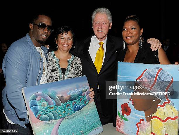 Rapper Sean "Diddy" Combs, Debra Lee, Chairman & CEO of BET, former President Bill Clinton, and actress Queen Latifah look at Haitian paintings...
