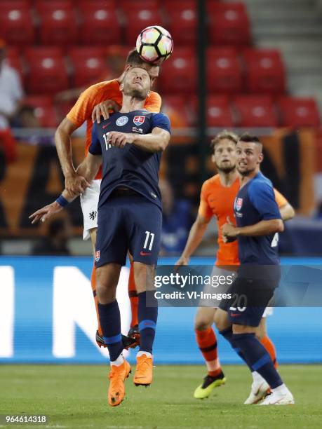 Stefan de Vrij of Holland, Adam Nemec of Slovakia, Daley Blind of Holland, Robert Mak of Slovakia during the International friendly match between...