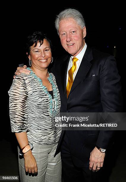 Debra Lee, Chairman & CEO of BET with former President Bill Clinton backstage at the BET SOS Saving Ourselves - Help for Haiti benefit concert and...