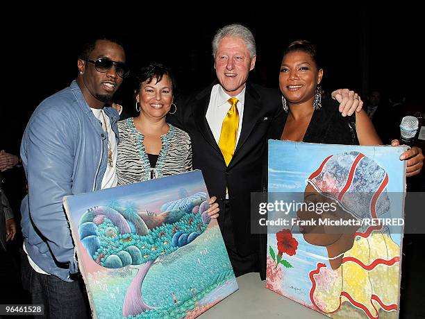 Rapper Sean "Diddy" Combs, Debra Lee, Chairman & CEO of BET, President Bill Clinton, and actress Queen Latifah look at Haitian paintings backstage at...
