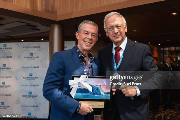 Radio Personality Elvis Duran and Godfather to Norwegian Bliss receives plaque from Bernard Meyer, managing director of Meyer Werft on board...