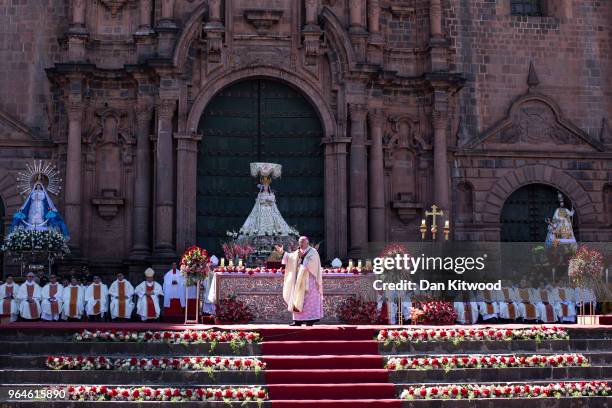 Priest Nicola Girasoli speaks to the crowd as Corpus Christi is celebrated in Plaza De Armas on May 31, 2018 in Cusco, Peru. Members of the public...