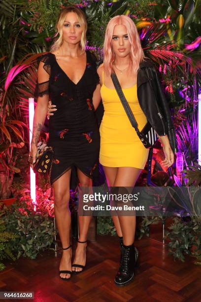 Lou Teasdale and Lottie Tomlinson attend the REVOLVE 'LA Party In London' hosted by Winnie Harlow at Hotel Cafe Royal on May 31, 2018 in London,...