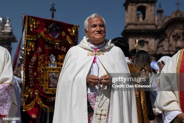 Priest Nicola Girasoli leads a procession as Corpus Christi is celebrated in Plaza De Armas on May 31, 2018 in Cusco, Peru. Members of the public and...