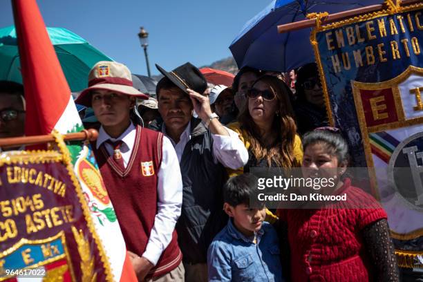 Members of the public and school groups listen as Corpus Christi is celebrated in Plaza De Armas on May 31, 2018 in Cusco, Peru. Thousands of members...