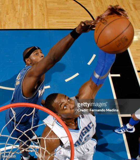 February 5: Dwight Howard of the Orlando Magic grabs a rebound against Brendan Haywood of the Washington Wizards during the game on February 5, 2010...