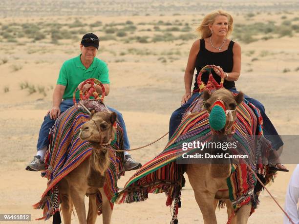 Tom Watson of the USA and his wife Hilary Watson take a ride on a camel during their visit to the Jumeirah Bab Al Shams Desert Resort after his...