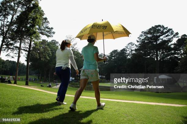 Inbee Park of South Korea and In Gee Chun of South Korea walk the eighth hole during the first round of the 2018 U.S. Women's Open at Shoal Creek on...