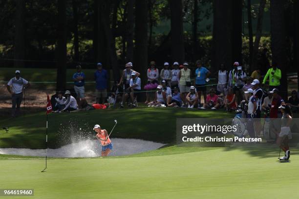 In-Kyung Kim of South Korea plays from the bunker onto the eighth green during the first round of the 2018 U.S. Women's Open at Shoal Creek on May...