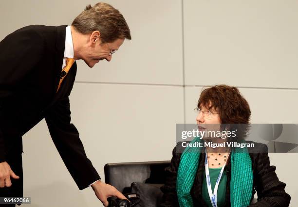 German Foreign Minister Guido Westerwelle talks to EU foreign policy chief Catherine Ashton during the second day of the 46th Munich Security...