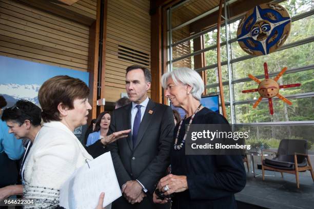 Kristalina Georgieva, chief executive officer of the World Bank Group, left, speaks while Bill Morneau, Canada's minister of finance, center, and...