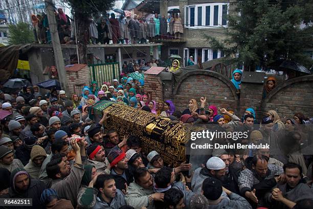 Kashmiri muslims show their emotions as they carry the coffin from the house of killed teenager Zahid Farooq to his burial place on February 06, 2010...