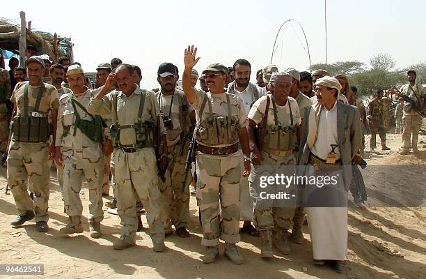 Yemeni Brigadier General Ali Mohsen al-Ahmar , commander of the Yemeni army in the northwestern region, waves as he visits soldiers battling Huthi...