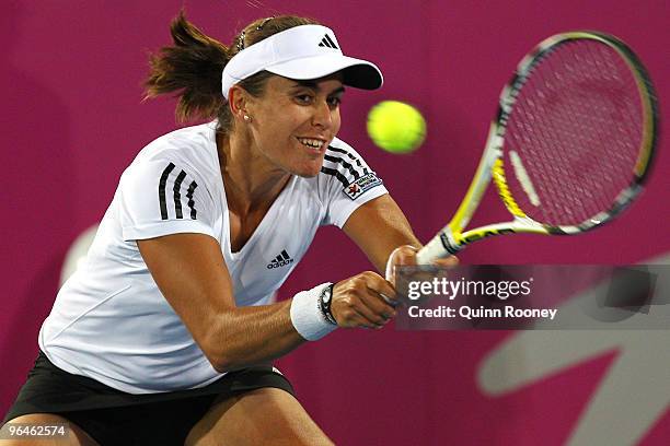 Anabel Medina-Garrigues of Spain plays a backhand in her singles match against Casey Dellacqua of Australia during the 2010 Fed Cup World Group II...