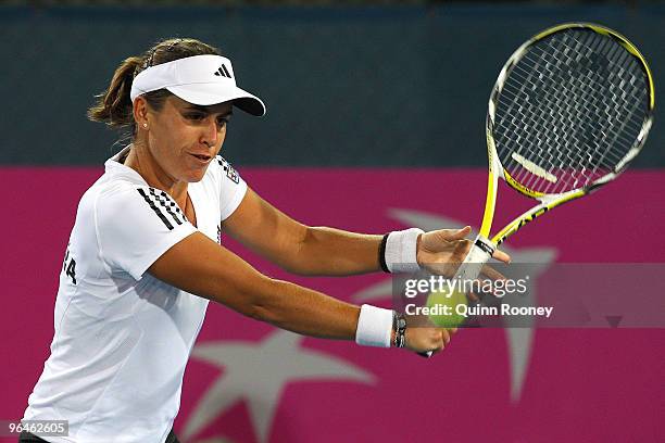 Anabel Medina-Garrigues of Spain plays a backhand in her singles match against Casey Dellacqua of Australia during the 2010 Fed Cup World Group II...