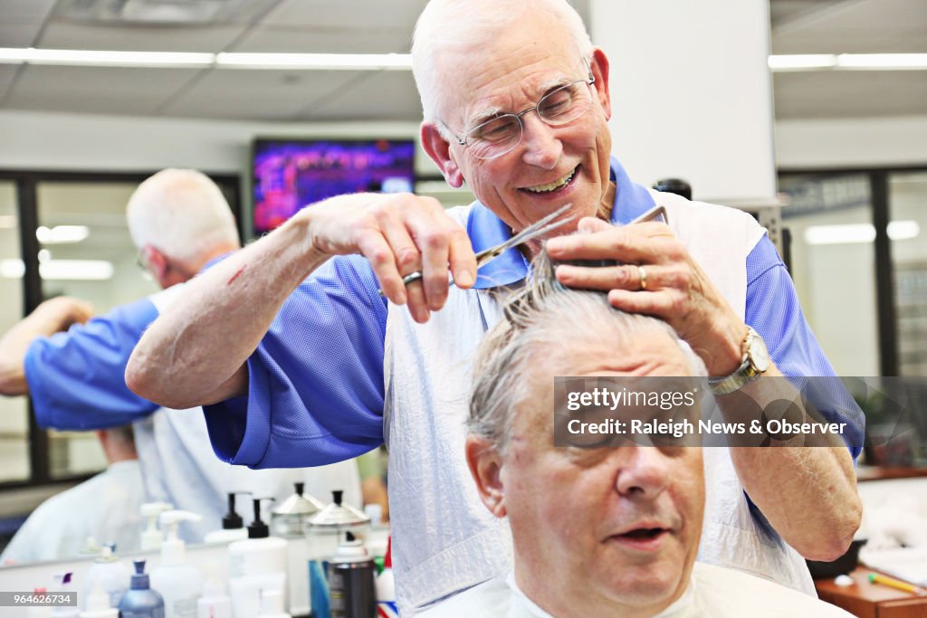 This barber outlasted the flattop and the mullet. At 85, his clippers are still buzzing