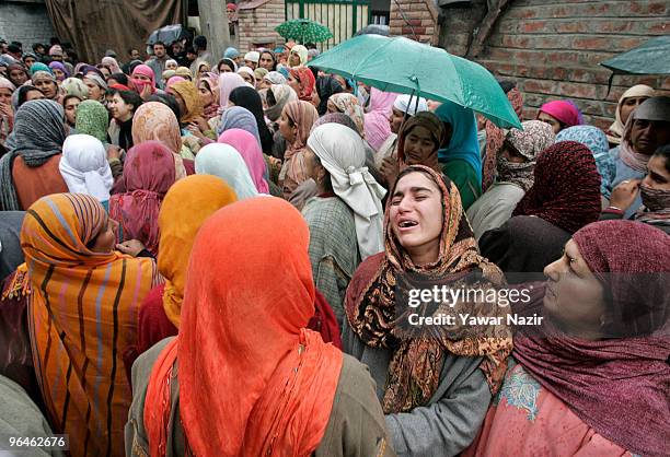 Relative of Zahid Farooq a 16-year-old teenager cries during his funeral on February 06, 2010 on the outskirts of Srinagar, India. Thousands of...