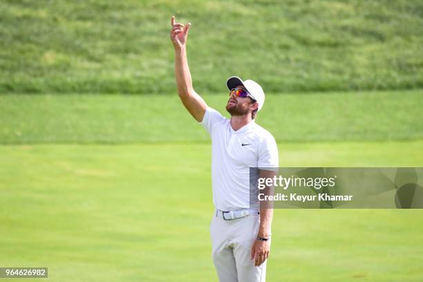 Patrick Rodgers tosses grass to check the wind on the 17th hole during the first round of the Memorial Tournament presented by Nationwide at...