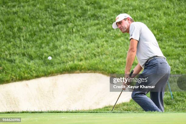 Lucas Glover chips a shot to the 17th hole green during the first round of the Memorial Tournament presented by Nationwide at Muirfield Village Golf...