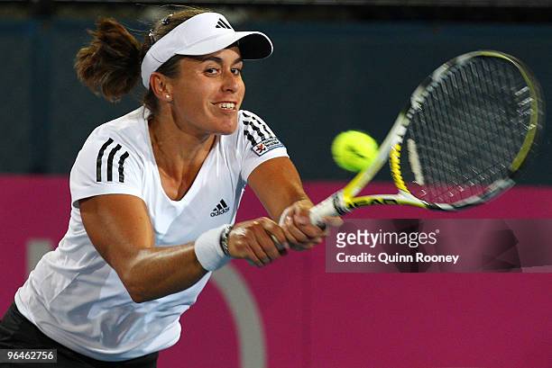 Anabel Medina-Garrigues of Spain plays a backhand in her singles match against Casey Dellacqua of Australia during the 2010 Fed Cup World Group II...